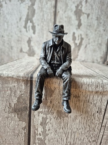 Indiana jones sitting ledge - indiana,